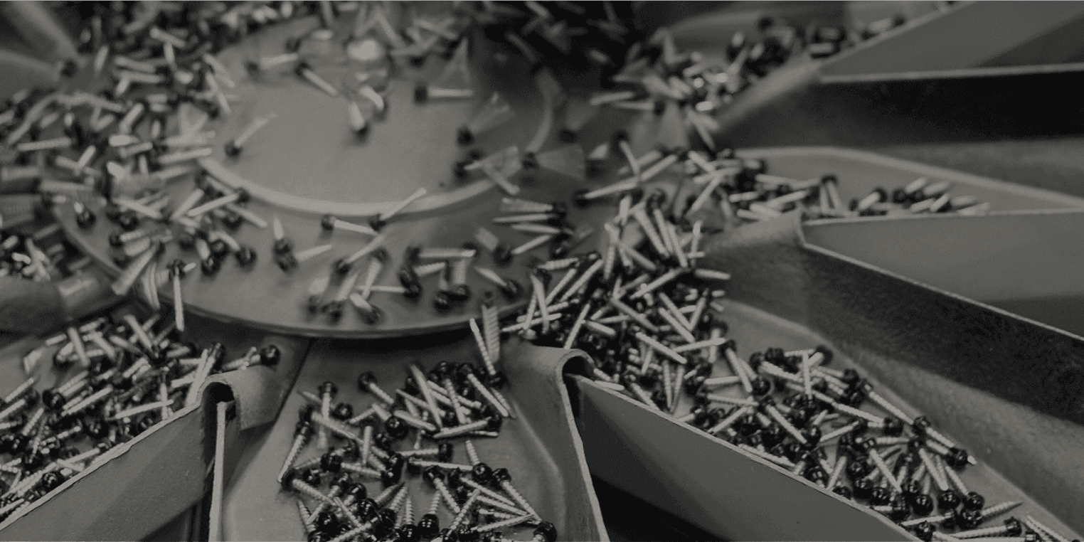 Fasteners moving through Unite production equipment.